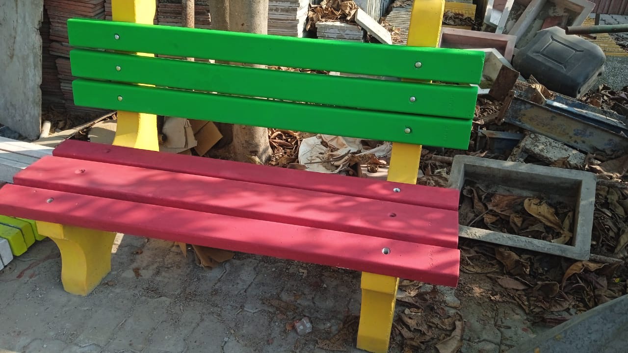 Benche in green back, red seat, yellow ends.