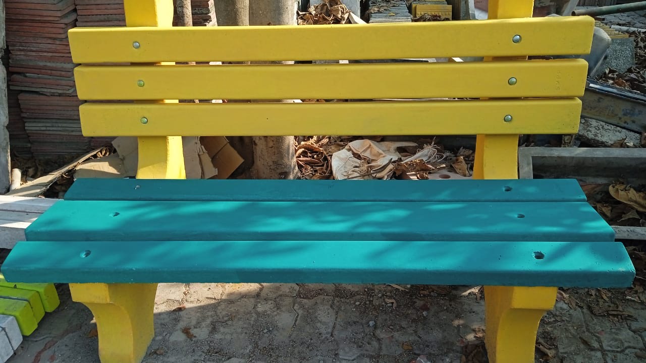 Benche in yellow back, teal seat, yellow ends.